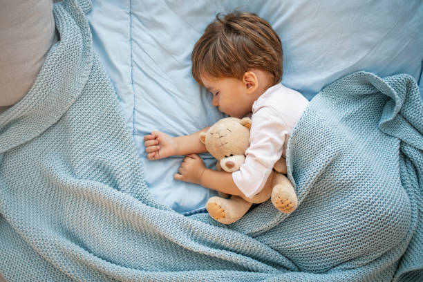 istock Sweet little boy sleeps with a toy. 1175501452