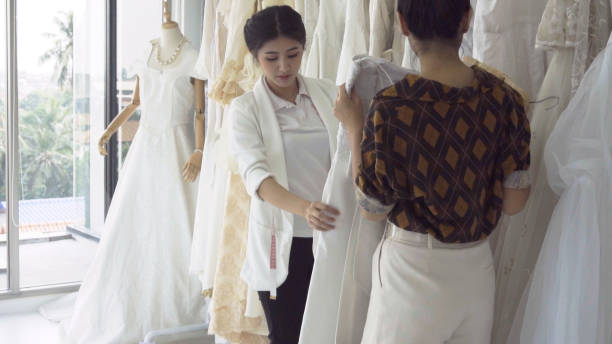 istock Future bride customer talking with wedding store shopkeeper 1175502016