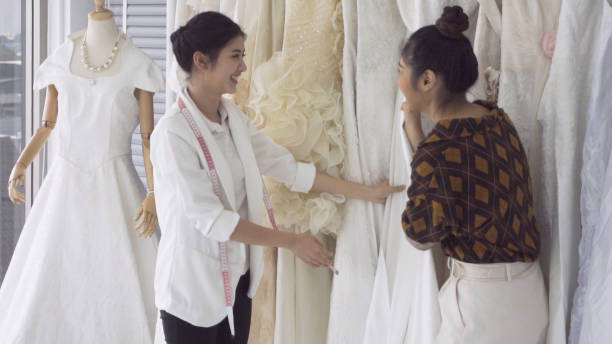 istock Future bride customer talking with wedding store shopkeeper 1175502138
