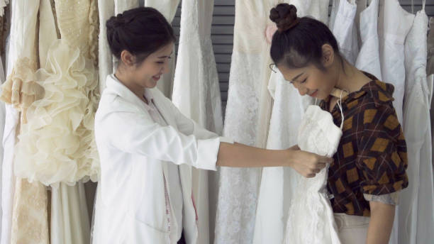 istock Future bride customer talking with wedding store shopkeeper 1175502139