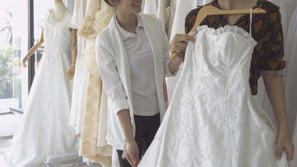 istock Future bride customer talking with wedding store shopkeeper 1175502271
