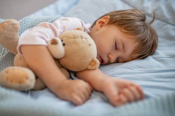 istock Sweet little boy sleeps with a toy. 1175502558