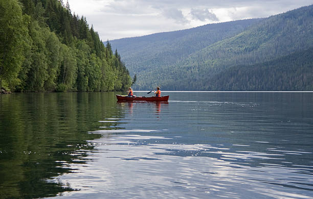 istock Girl and boy canoeing 117550287