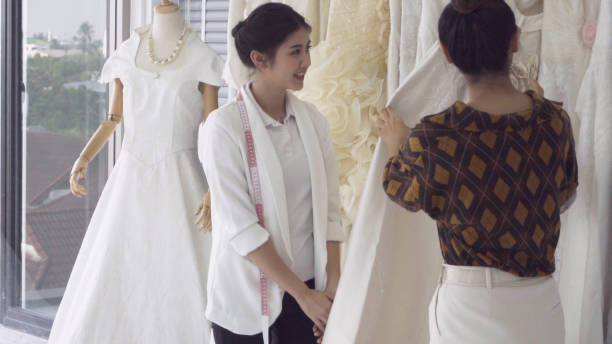 istock Future bride customer talking with wedding store shopkeeper 1175503217