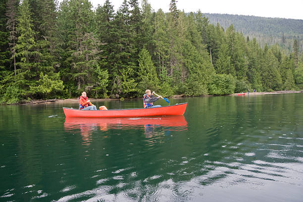 istock Girl and boy canoeing 117550354