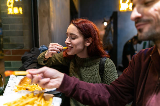 Hungry couple in fast food restaurant