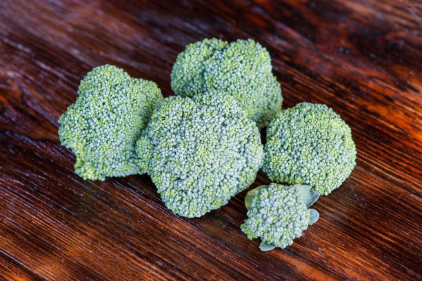 istock Fresh broccoli on a wooden table. Close-up, top view 1175503987