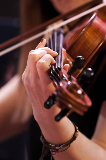 istock Hand girl playing the violin 1175504079