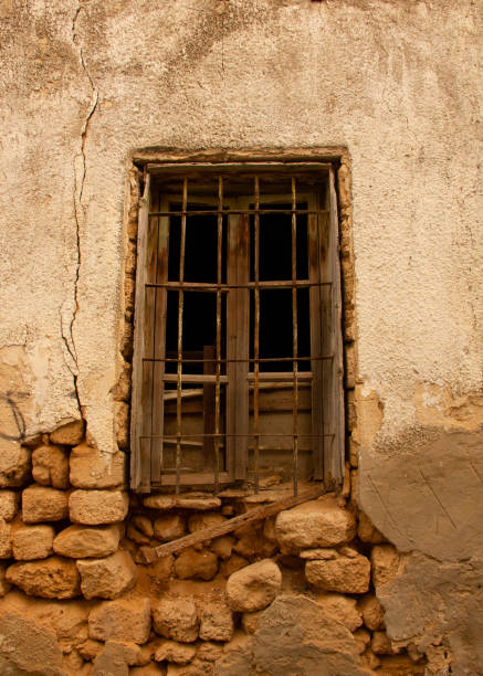 istock An old window in an old brick wall 1175505889