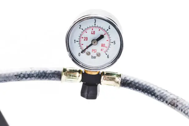 close up tire pressure gauge in the studio on a white background