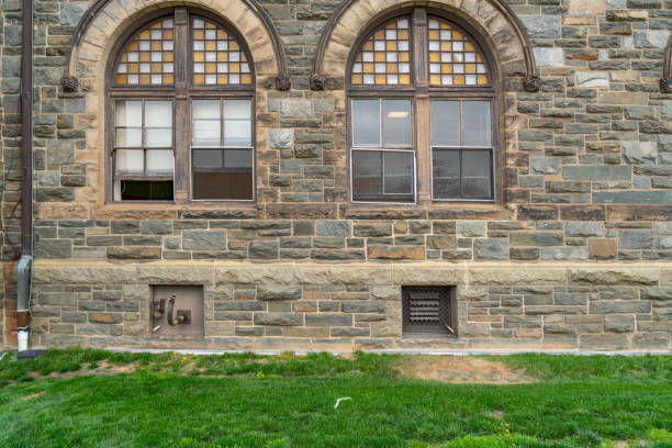 istock Old stone wall and windows of Church 1175506982