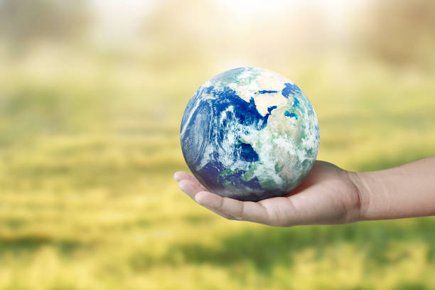 istock Globe ,earth in hand, holding our planet glowing. Earth image provided by Nasa 1175508122