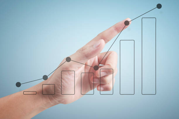 istock Hand touching a graphs of financial indicator and accounting market  chart 1175508149