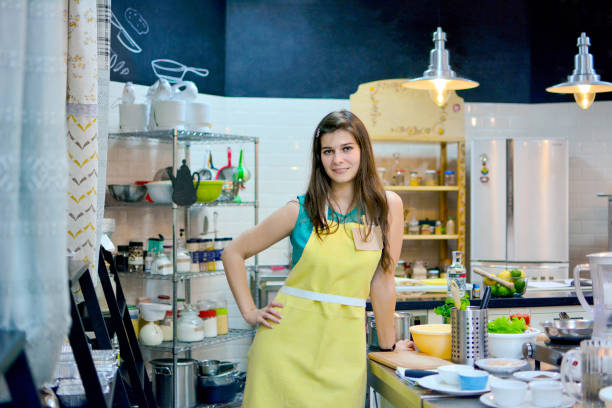 istock Young woman cook in the kitchen 1175509496