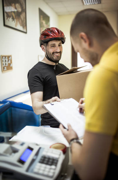 istock Bike courier delivering a package to client 1175509674