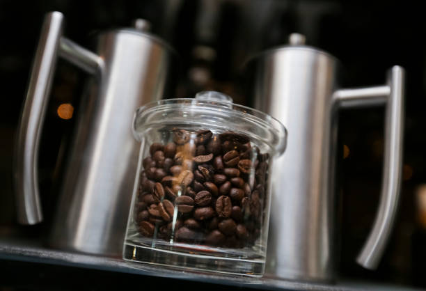 istock Coffee beans in jars 1175515109