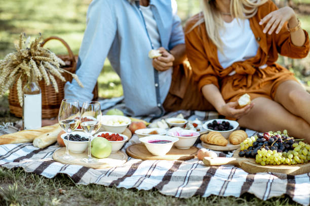 Couple having romantic breakfast outdoors