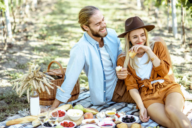 istock Young couple having a breakfast on the vineyard 1175521652