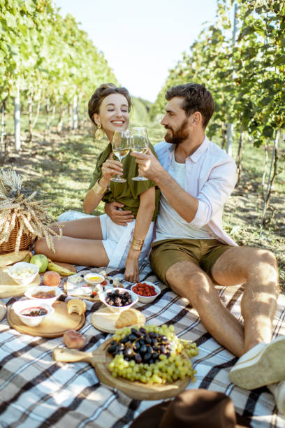 istock Young couple having a breakfast on the vineyard 1175521864