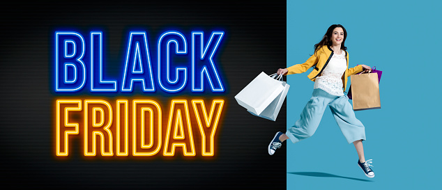 Black friday advertisement with cheerful shopping girl holding lots of bags, sale and offers concept