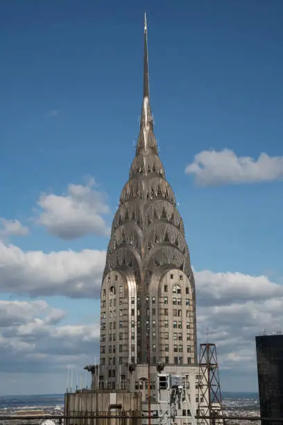 The top of the Chrysler Building as seen from a nearby rooftop in Midtown Manhattan, NY, USA