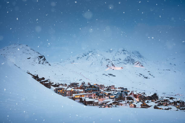 Val Thorens village on a snowy winter evening.