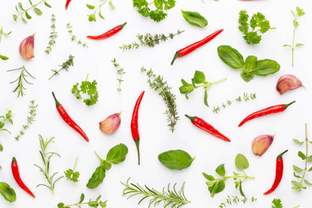 istock Spice herbal leaves and chili pepper on white background. Vegetables pattern. Floral and vegetables on white background. Top view, flat lay. 1175525307