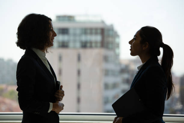 istock Confident female business colleagues discussing project 1175526754