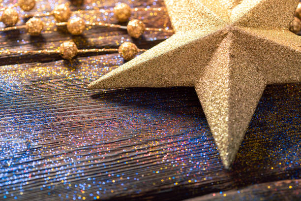 Golden star tree topper and christmas decorations