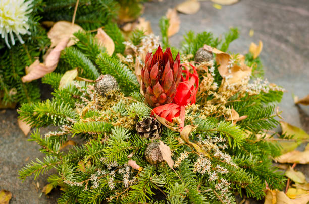 istock bright floral decoration on grave during All Saints Day in the cemetery 1175532425