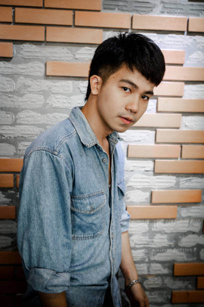 istock Young confidence handsome asian man standing looking at camera 1175532752
