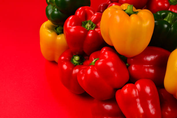 istock Fresh red, yelow, green bell pepper on a red background. 1175534525