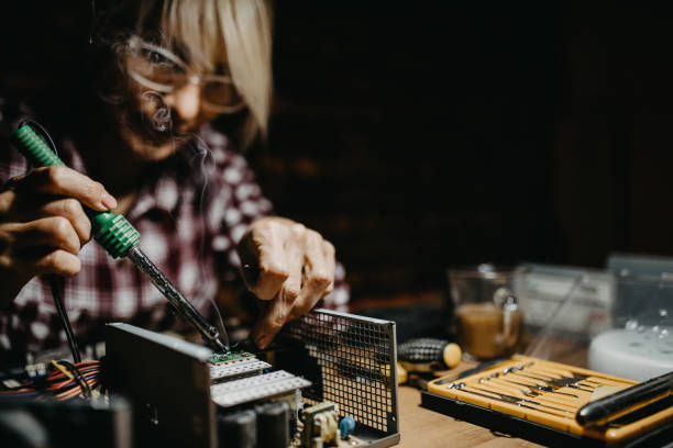 istock Mature female electronics repairing workstation 1175534545