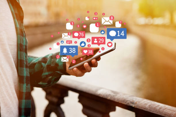 istock Man receives notifications on smart phone 1175535983