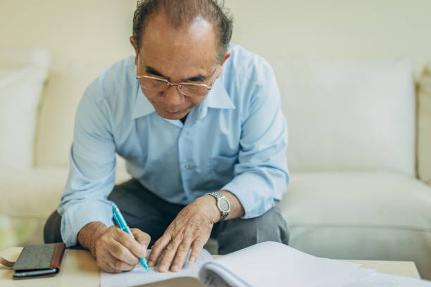 istock Senior man doing finances at home 1175537209