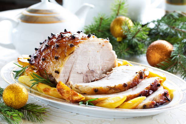 istock Roast pork with orange glaze, decorated with cloves. 1175537246