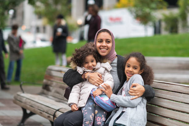 istock Muslim woman spending time with young daughters 1175539120