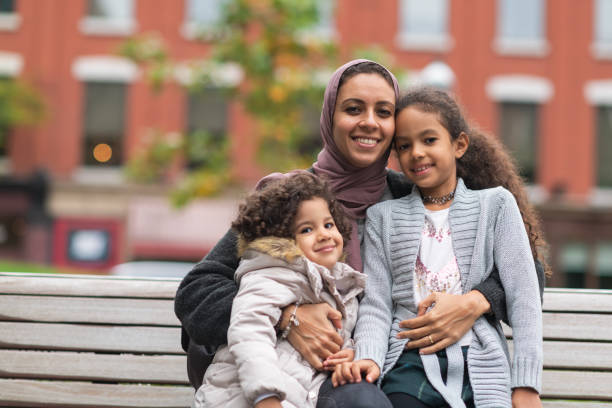 istock Muslim woman spending time with young daughters 1175539124