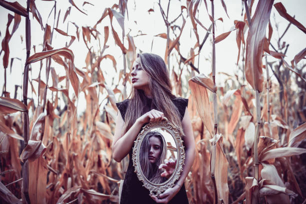 istock Female Roaming The Corn Fields With A Glass Mirror 1175539980