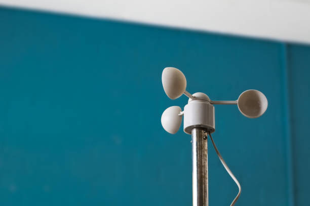 istock Anemometer or wind speed meter silhouetted against blue background 1175540976