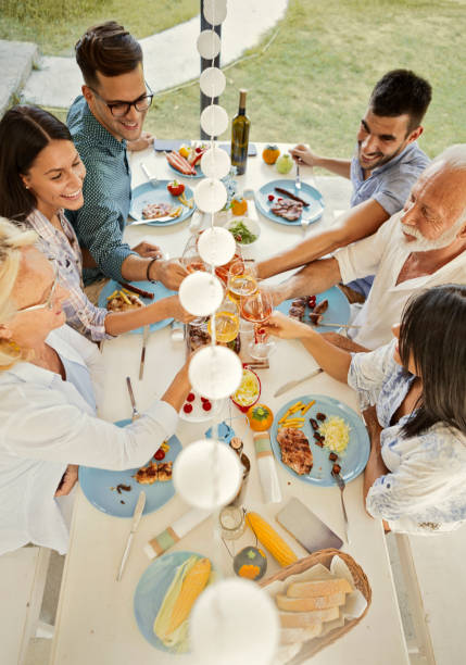 istock Family on a terrace making a dinner party toasting 1175541706