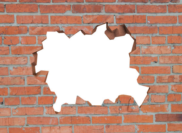 istock Destroyed brick wall. There is an isolated space for your photo or text 1175545179