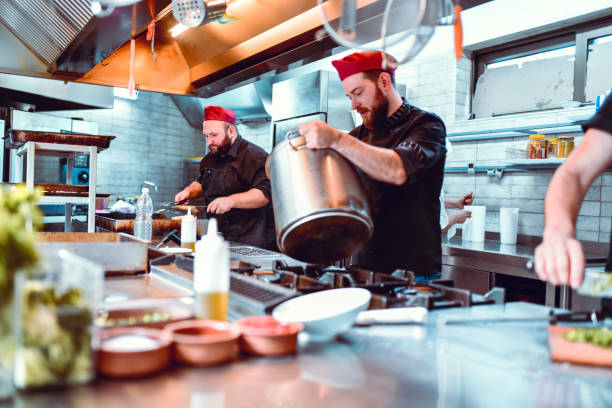 istock Everyone Is Busy In The Kitchen 1175545309