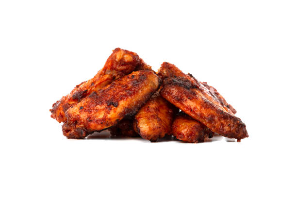 istock Fried wings close-up. Buffalo wings isolated on white. 1175548560
