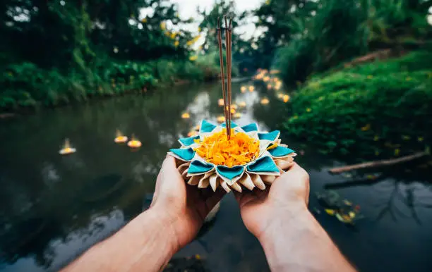 Loy krathong festival, thai new year party with floating buckets release in the river