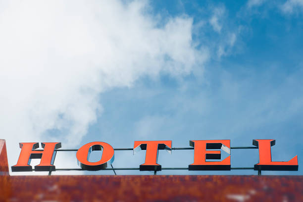 istock Hotel sign in sunlight, clear blue sky background. 1175549002