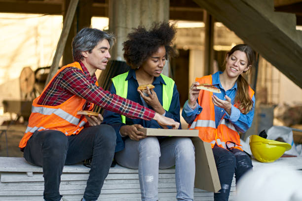 istock Multi-ethnic coworkers sharing lunch at site 1175550761