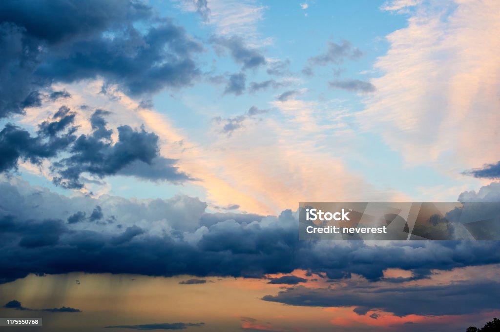 Stormy rain clouds at sunset Stormy rain dramatic clouds at sunset Atmosphere Stock Photo