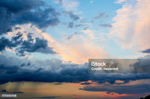 Stormy Rain Clouds At Sunset Stock Photo - Download Image Now - Atmosphere, Atmospheric Mood, Beauty
