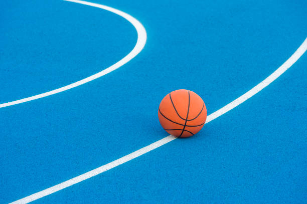 Orange Basketball ball on the blue surface